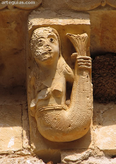 Canecillo de la iglesia de El Olmo, Segovia